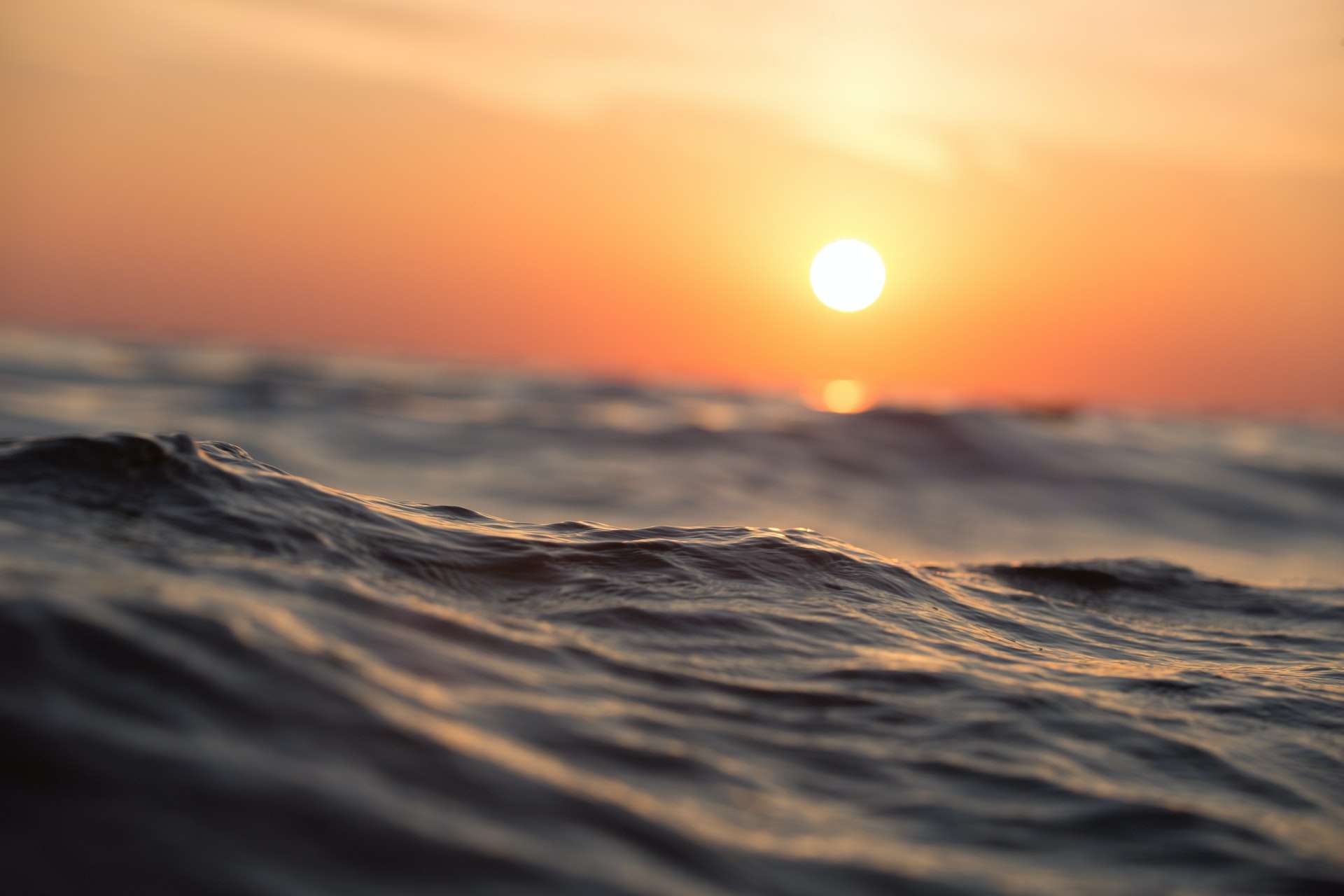 Sun shining in an orange sky